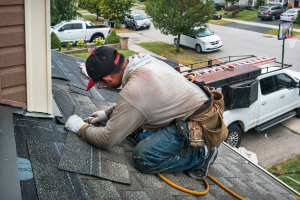 Professional Roofing technician working in Laurel Hollow, NY